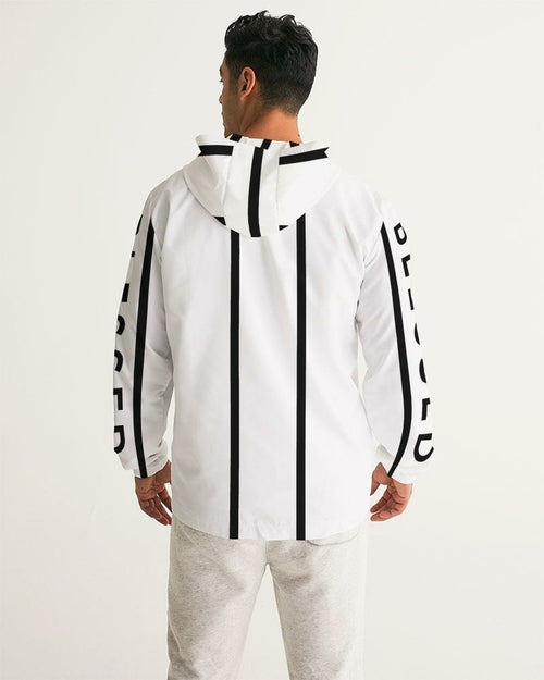 Person wearing a white jacket with black stripes and text on a plain background