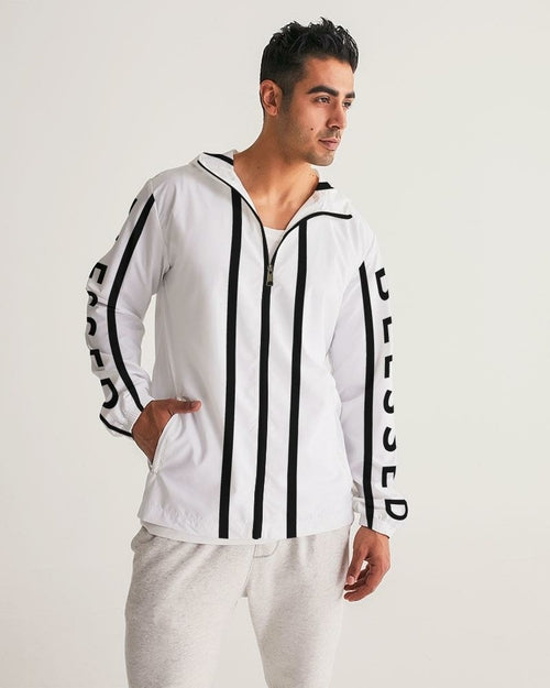 Man wearing a white tracksuit with black stripes and text on a light gray background