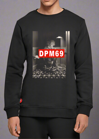Black sweatshirt with graphic design and 'DPM69' text worn by a person on a gray background