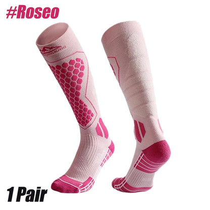 Pink and white compression socks with visible brand logo on a white background