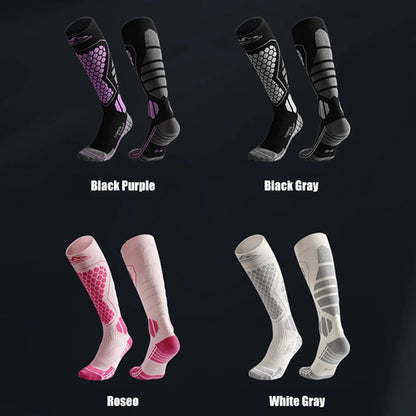 Four pairs of compression socks in different color combinations on a black background.
