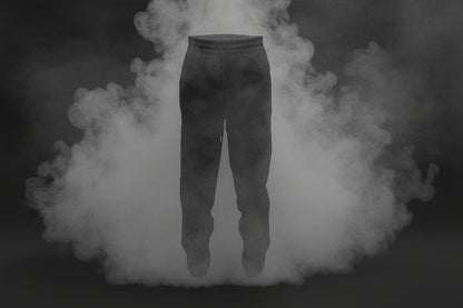 Dark pants floating in a cloud of smoke against a dark background