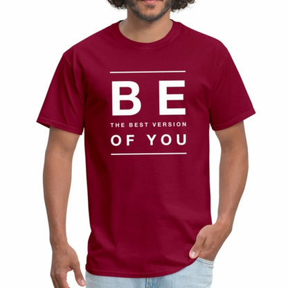 Red t-shirt with motivational text worn by a person on a white background