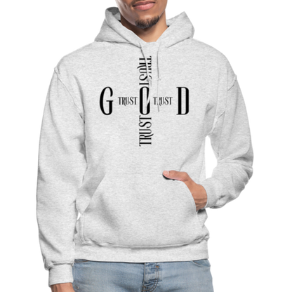 Person wearing a gray hoodie with text design on a white background